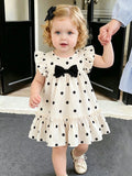 SHEIN Baby Girls' Summer Polka Dot Dress  Black & White Dots+Bow Decor On Chest+Flare Sleeves  Soft & Cute  Suitable For Daily Outings And Photo Shoots